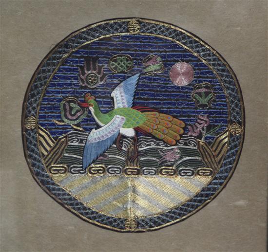 A Chinese embroidered silk and metal thread peacock roundel, 29cm diam., framed and glazed